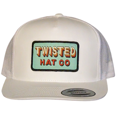 White yupoong 6006 snapback with a sage green retro 90's style patch 
